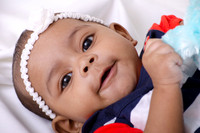 Newborn portrait session in basket at Lawanda King Photography studio