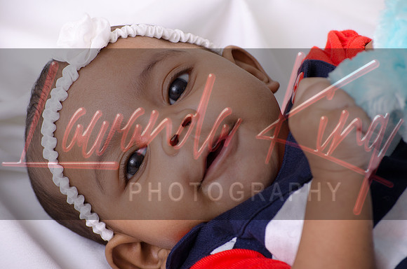 Newborn portrait session in basket at Lawanda King Photography studio