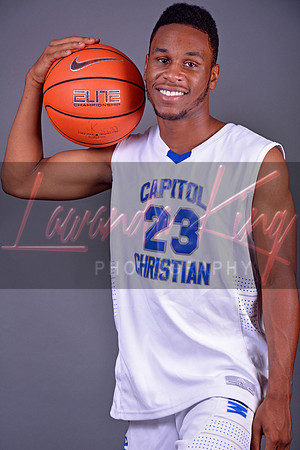 Graduating athlete with basketball at Capitol Christian Academy