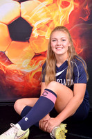 High school senior soccer player with fire soccer ball background at Lawanda King Photography studio