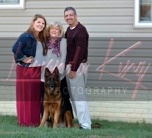Family standing outside home with German Shepherd in Charles County MD