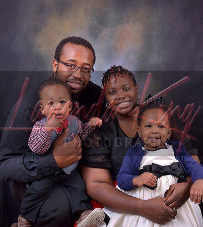 Family portrait of parents with infant toddler children at Lawanda King Photography studio