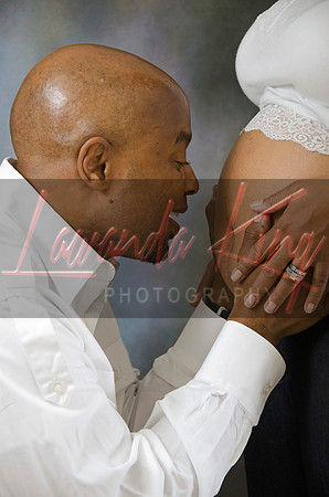 Sweet maternity photo of dad bonding with unborn baby in studio session at Lawanda King Photography