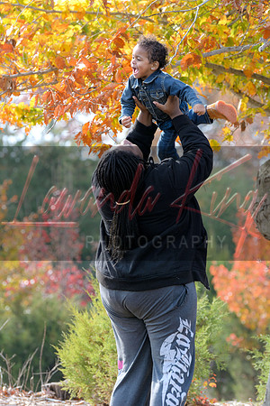 Candid family moment between mom and daughter during fall session in Charles County
