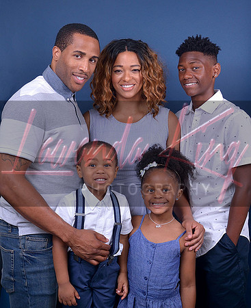 Family portrait session with parents and children with blue background at Lawanda King Photography s