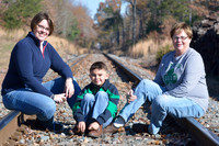 Outdoor autumn photo of family on railroad tracks in Charles County