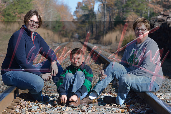 Outdoor autumn photo of family on railroad tracks in Charles County