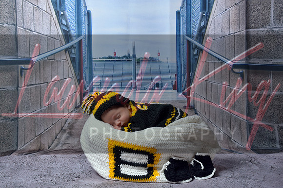 Newborn portrait session with stadium background at Lawanda King Photography studio