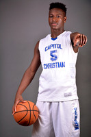 Graduating athlete with basketball at Capitol Christian Academy