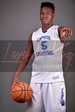 Graduating athlete with basketball at Capitol Christian Academy