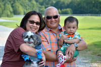 Family portrait in park with parents, baby boy and dog in White Plains, MD
