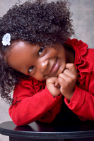 Child with red sweater headshot session in studio at Lawanda King Photography