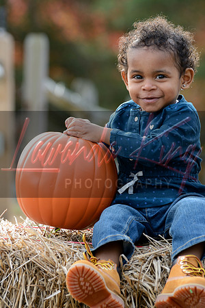 Fall outdoor session with little girl and pumpkin in Charles County MD