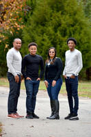 Family portrait with parents and two sons on trail in White Plains MD