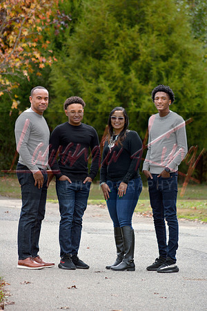 Family portrait with parents and two sons on trail in White Plains MD