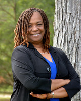Professional headshot taken outdoors at Turkey Hill Park in White Plains, MD