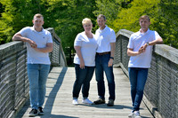 Outdoor family portrait at Gilbert Run Park on bridge with Lawanda King Photography