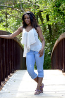 Outdoor high school senior outdoor portrait session on bridge at park in Prince George's County, MD
