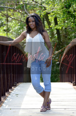 Outdoor high school senior outdoor portrait session on bridge at park in Prince George's County, MD